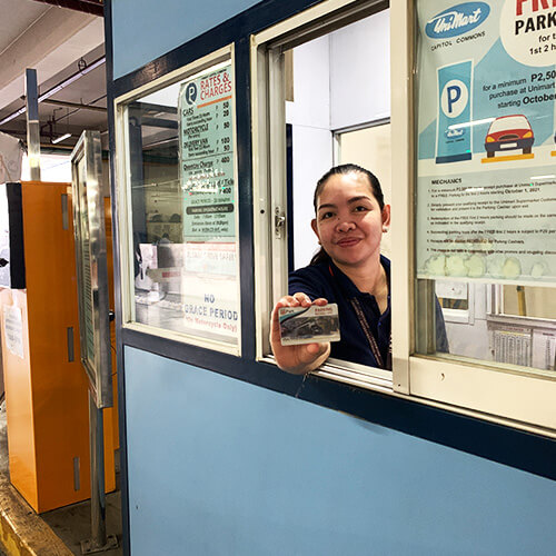 Upark Parking Attendant showing her Business Card