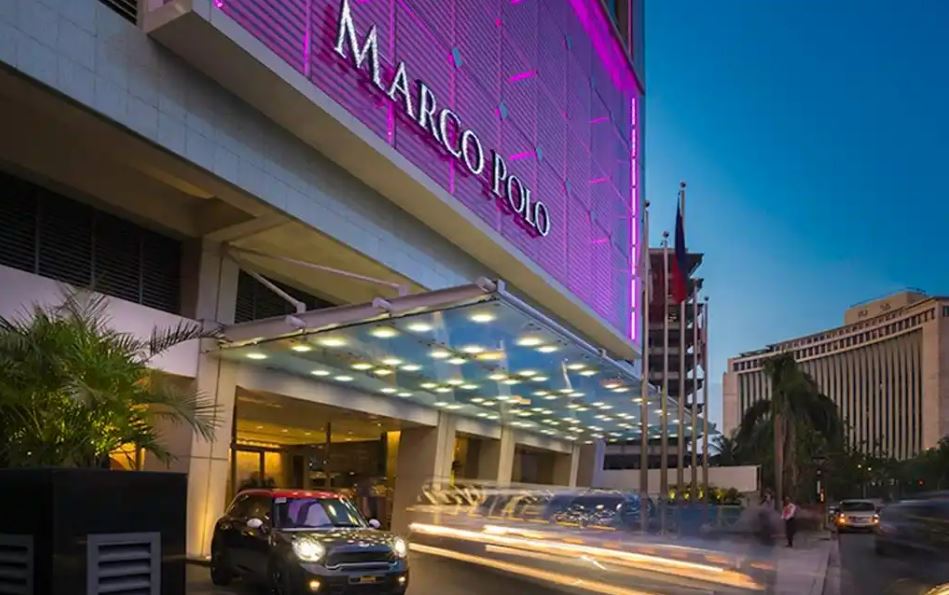 Outside Marco Polo Hotel near the entrance of the lobby