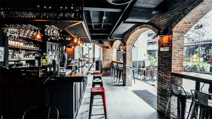 Interior of Moonshine PUB x Public Urban Bar showing their collection of drinks