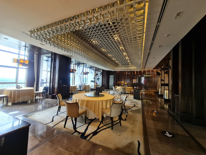 Inside the Lung hin Restaurant showcasing its white, black, and gold interior