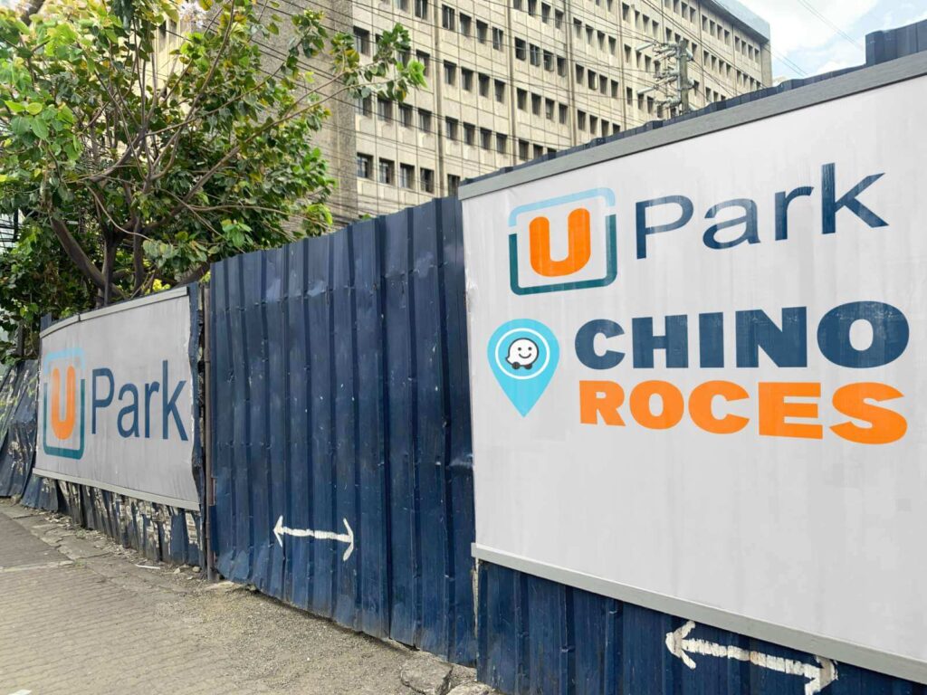 Blue entrance to the UPark parking facility with large UPark signage in front