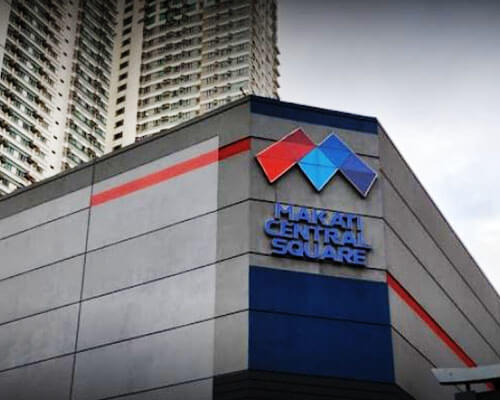 Upper part of Makati Central Square Building where the logo and name is located