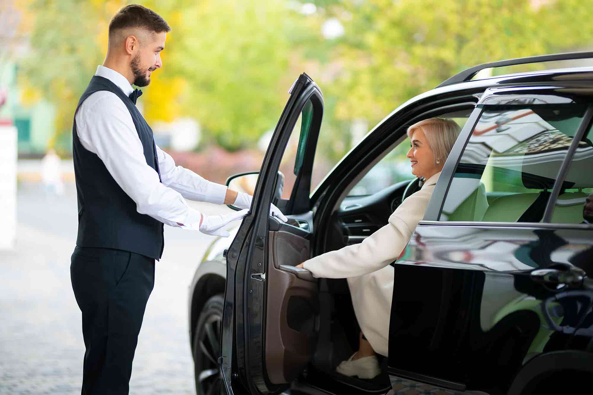 parking valet attendant help woman park her car