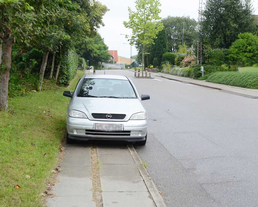 car parked on the sidewalk